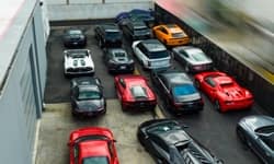 Outdoor lot filled with exotic cars