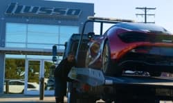 Exotic car being loaded onto a tow truck